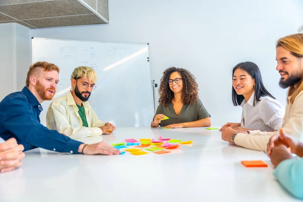 A team brainstorming together around a table during a workplace learning session.